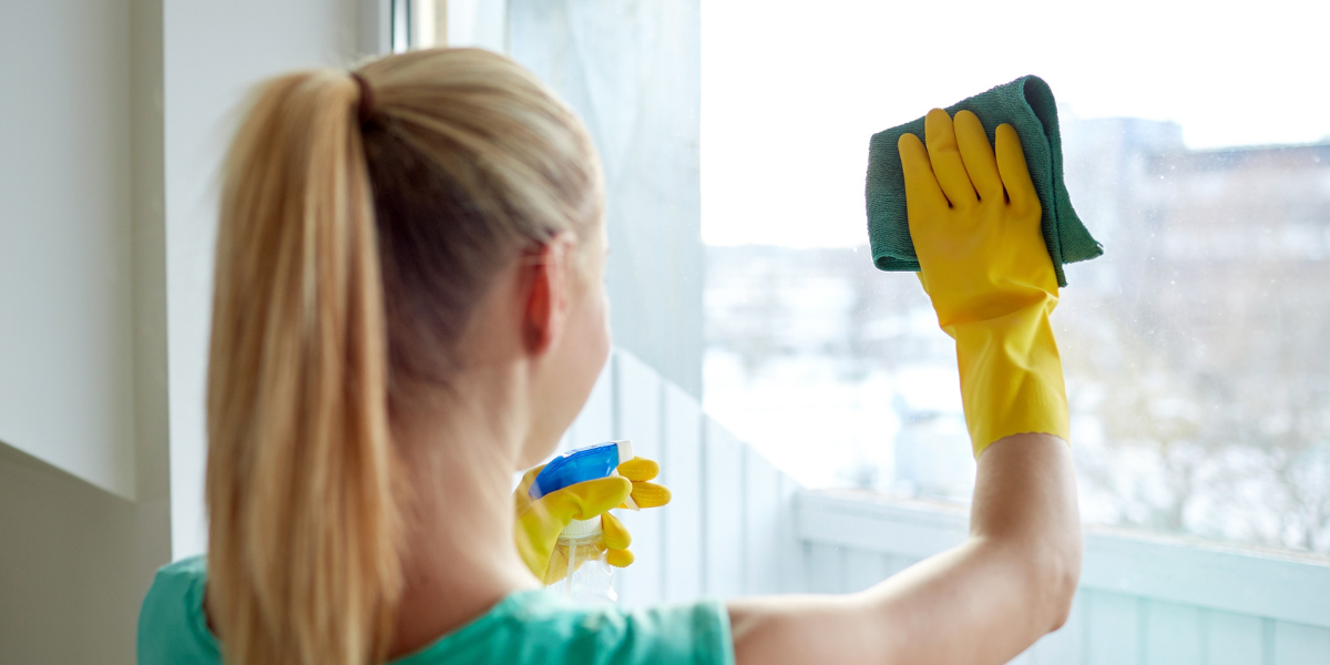 Woman Cleaning Window